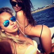 A brace of boating bikini beauties