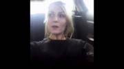 In her car at a public parking lot.