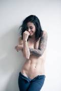 Jeans, tats, black hair