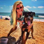 Babe and dog at beach [x-post /r/NonNude]