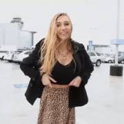 Cute blonde flashing in a parking lot