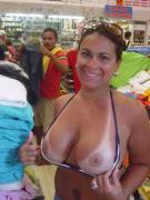Showing off her tan-lined-titties in the store