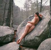 Leaning on a rock