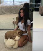 Model plays with a lion cub