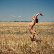 standing in field wheat