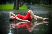 Alone in the rain, that look says it all... [x-post /r/redlingerie]