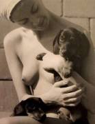 "Nude with Dachshunds" photographed by Man Ray (c. 1934)
