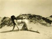 Nude Crawling on the Dunes photographed by Edwin Bower Hesser (c.1926)