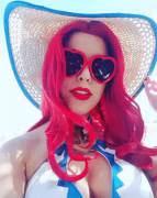 Red hair, red lips, red sun glasses, red hot.