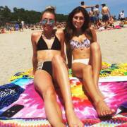 At the beach with her friend