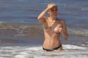 Miley Cyrus topless at the beach