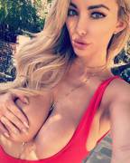 Lindsey Pelas with just one handbra