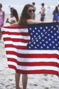 Redhead beauty with her flag at the beach (x-post /r/FlagBabes)