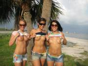 Three girls flashing their tits at a beach