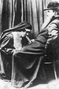 Kneeling but not praying.