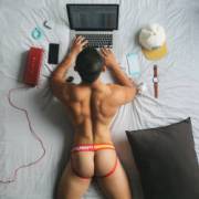 Studying in his jockstrap