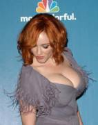 Sexy redhead Christina Hendricks stretches her top to bursting