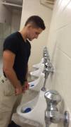 Muscle guy taking a leak