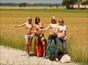 Four topless hitchhikers