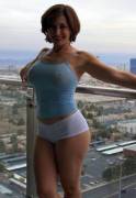 Hot curvy mom posing on balcony