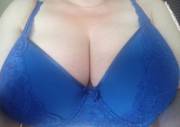 Blue bra holding 38 GG's