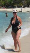 Curvy MILF looks great in a black one piece