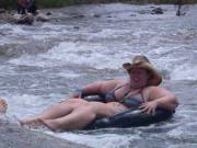 Tubing down the river and falling out of her bikini