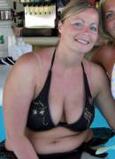 Curvy MILF having fun at a swim up bar