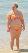 BBW in a bright bikini enjoying a sunny beach