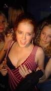 Redhead flashing her tits