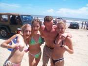 Two girls flashing on the beach