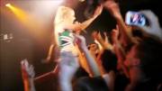 Iggy Azalea dressed as a cheerleader getting groped on stage