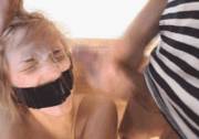 Tape gagged slut gets a load