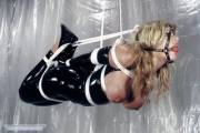 Suspended and gagged with tits hanging out. Probably the most helpless one can possibly get.