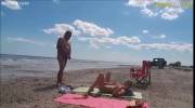 Hotwife sucks a portly stranger on the beach