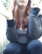 Clothed and smoking.