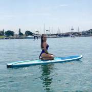 Jojo Levesque on a surfboard 