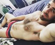 Cute guy reclining, showing his pit