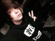 Cute emo boy doing the peace symbol