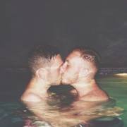 Kissing in the pool at night