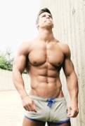 Kris Evans flexing his pecs