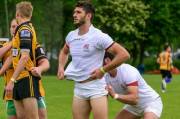 Zurab Dzneladze of the Georgia Rugby Sevens team gets some help from a teammate (photographed by Kevin Scott)