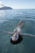 One of the jellyfish women of Nuapota Island waits patiently for tiny fish to become entangled in her hair