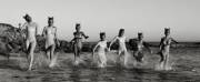 A herd of wild ponygirls thunders through the surf