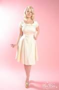 Demure beverly; full swing skirt; In a creamy vanilla, and anything but plain. 