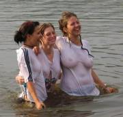 3 swimming in white shirts