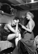 Windmill girls backstage, 17th August 1940. The one on the right, Sonia Stacpoole, is reading "Picture Post".