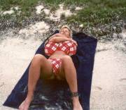 Busty Dusty and her cantaloupes laying out on the beach