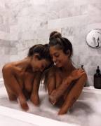 Twins taking a bath together