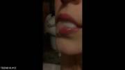 Letting it drip out of her mouth slowly
